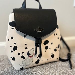 Kate spade 101 Dalmatian backpack with draw string and magnetic closure.